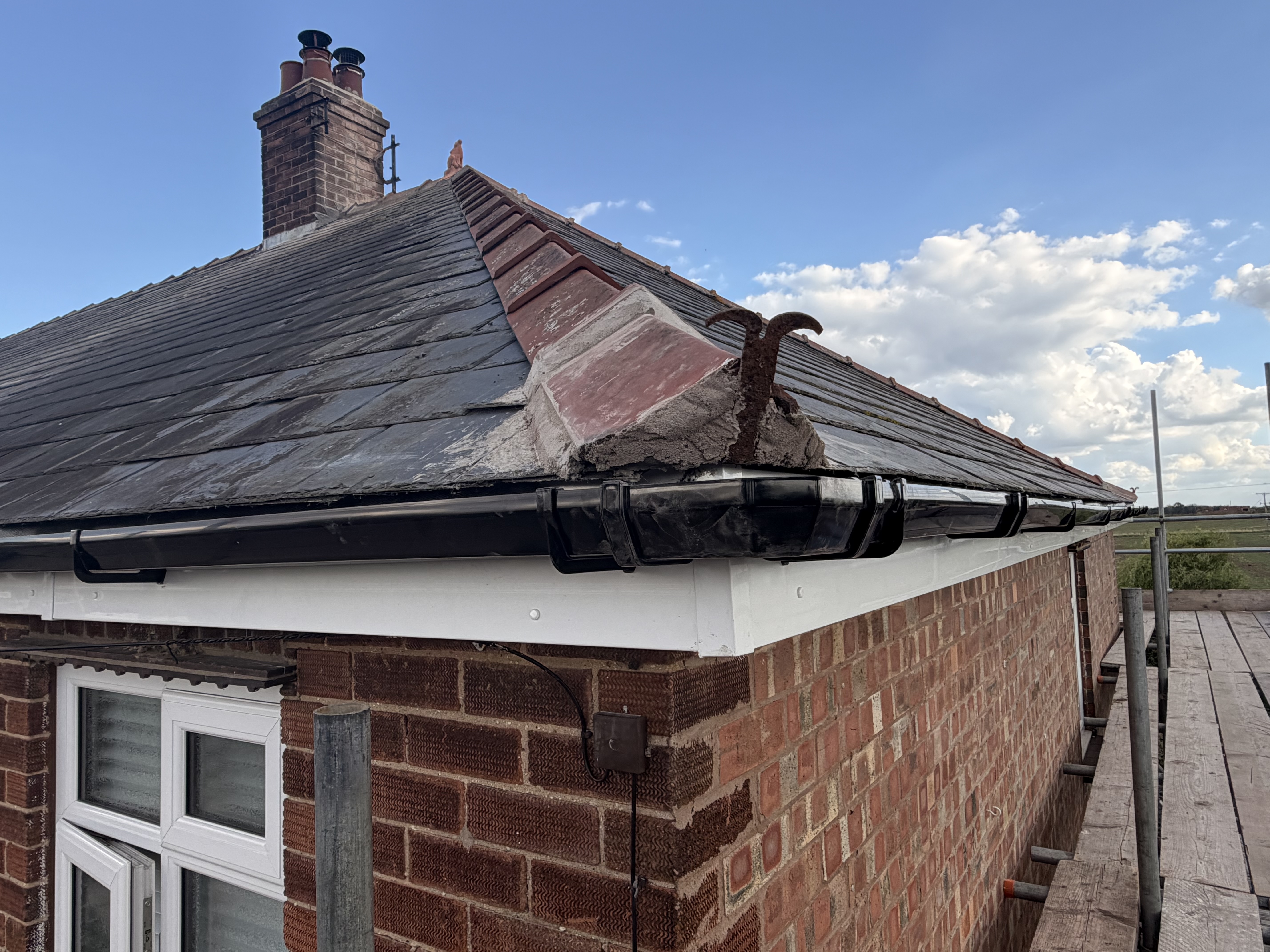 Completed slate roof and chimney from the front side