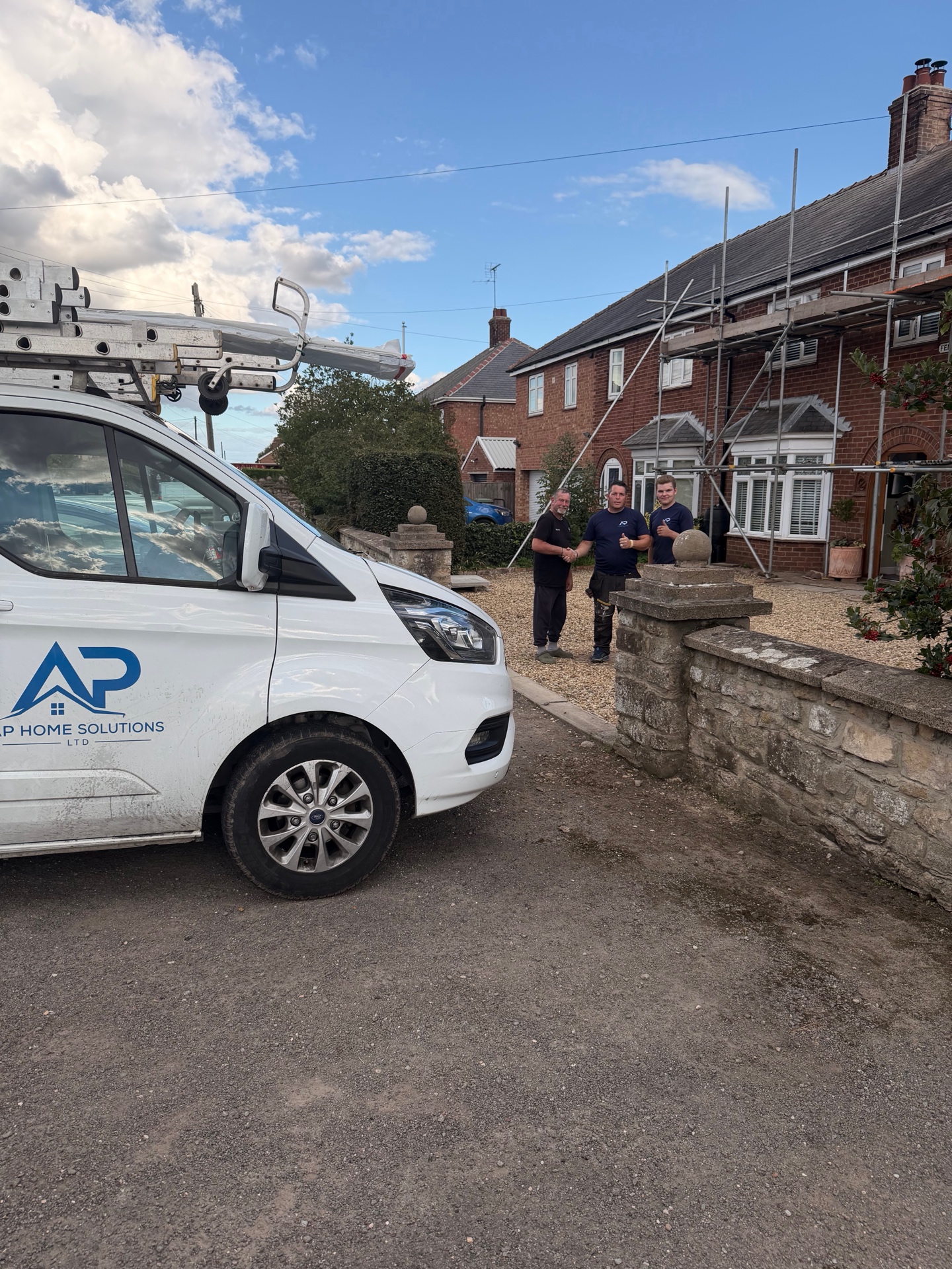 AP Home Solutions team and van beside the completed roof