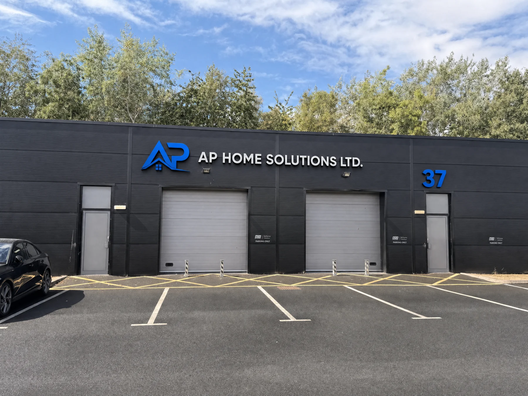 AP Home Solutions Ltd business frontage with company signage and marked parking spaces